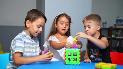 Explorative process Kindergarten students in classroom playing cognitive game Stock Footage 259834432