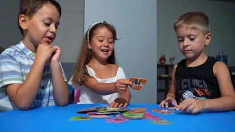 Explorative process Kindergarten students in classroom playing cognitive game Stock Footage 260465812