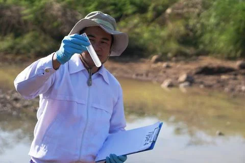 Explore, analysis water quality from natural source. Ecology field research. Stock Photos