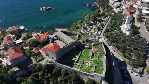 Explore the ancient fortress overlooking the stunning coastline of a Stock Footage 287801272