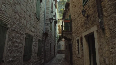 Explore ancient stone streets in a picturesque coastal town Kotor in Montenegro Stock Footage 296190459