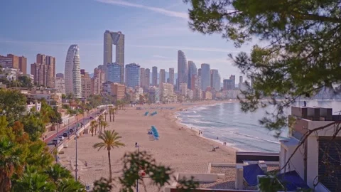 Explore the beaches and skyline of Benidorm during sunny days in Spain with clea Stock Footage 337151939