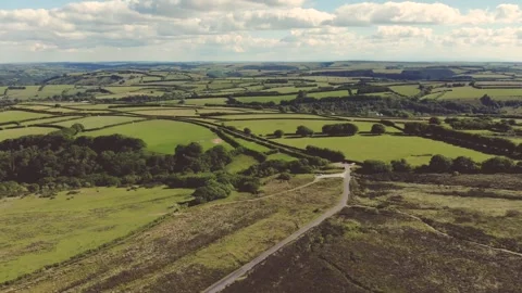 Explore beautiful rolling hills and fields in a scenic countryside Stock-Footage 320304328