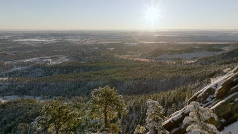 Explore the beauty of mountain rocks and forests in a serene town at sunrise Stock Footage 288901343
