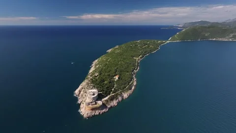 Explore the breathtaking aerial view of Prevlaka Peninsula showcasing its lush Video stock 287789239