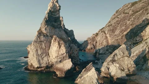 Explore breathtaking beach coast and sea rocks under the clear sky Stock Footage 321492704