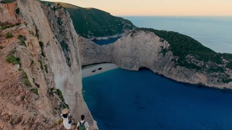 Explore the breathtaking beauty of Navagio Beach in Zakynthos Greece at sunset Stock Footage 337372010