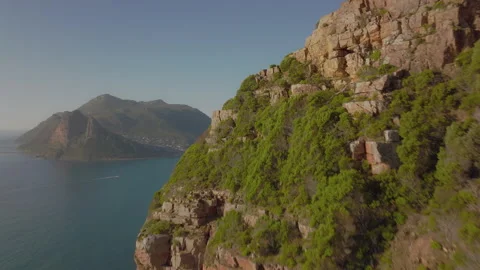 Explore breathtaking cliffside views over the ocean in South Africa Stock Footage 288099435