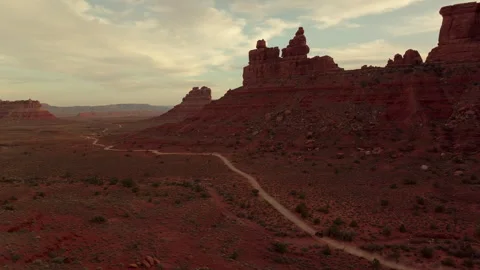 Explore the breathtaking Desert Valley of Gods in Utah during sunset Stock Footage 288876690