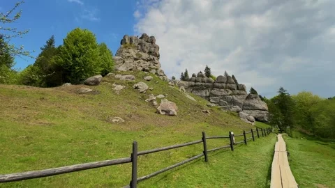 Explore breathtaking rocky landscapes surrounded by vibrant greenery. A perfect Stock-Footage 308781500