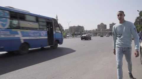 Explore Car Traffic and Pedestrian Movement in El Hegaz Street Heliopolis Cairo Stock Footage 317929504