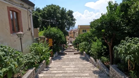 Explore the charming streets of Sicily with stunning views on a sunny day Video stock 285591957