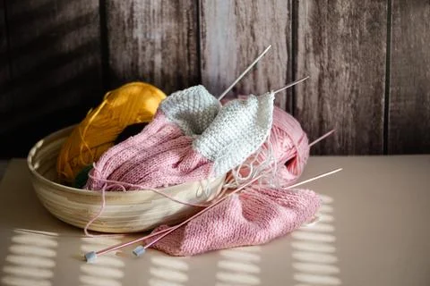 Explore cozy knitting supplies, lovingly crafted and arranged in a charming.. 写真素材