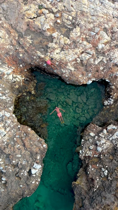 Explore the crystal-clear waters of Paros Island, Greece while swimming and Stock Footage 337366150