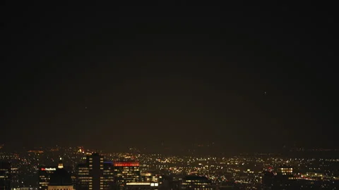 Explore the dark city lights of Salt Lake City at night from above and below Stock Footage 310158027