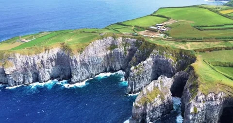 Explore the dramatic cliffs and rocky coastline of São Miguel Island in the Azor Stock Footage 285538309