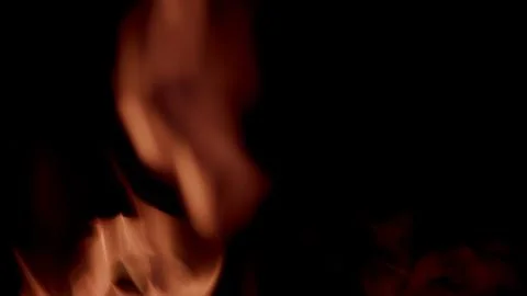 Explore the dynamic flame patterns against a dark background, evoking beauty and Stock Photos