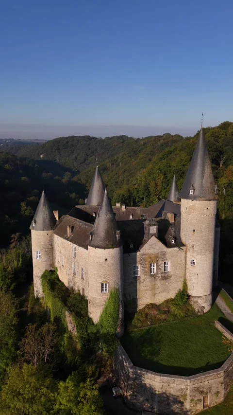 Explore the enchanting Veves Castle surrounded by lush forests and hills Stock Footage 295146193