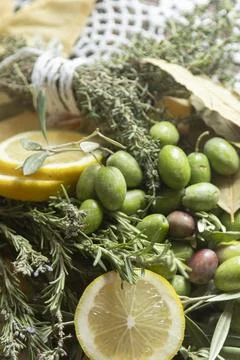 Explore Fresh Herbs, Olives, and Lemons for culinary inspiration in cooking.. Stock Photos