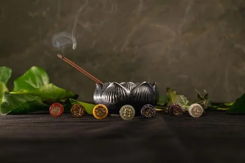 Explore the harmony of chakras with incense and nature in serene surroundings Stock Photos
