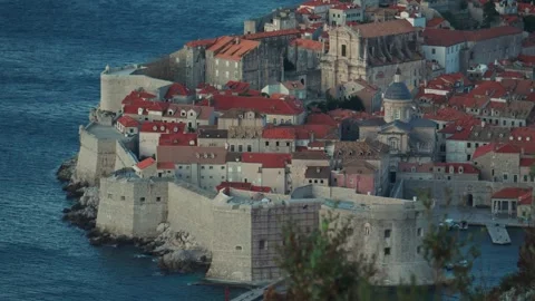 Explore historic architecture and coastal beauty in Dubrovnik during sunrise Stock Footage 313731576