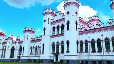 Explore a historic castle complex with towers and gardens on a bright day Stock Footage 324967147