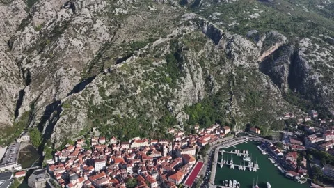 Explore the historic charm of Kotor Old Town and its stunning coastal views Stock Footage 287781560