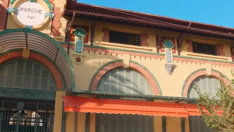 Explore the Historic Charm of Menton's Sunlit Market Building in France Vídeos de archivo 327851219