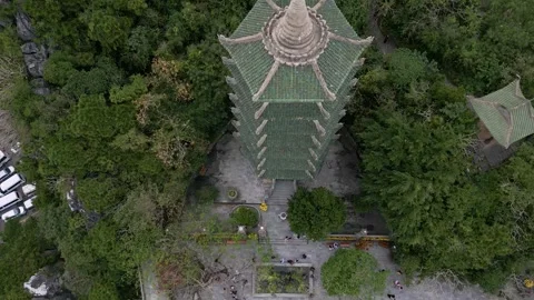 Explore historic tower surrounded by lush forest and vibrant paths Video stock 310069119