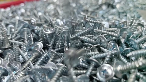 Explore the intricate beauty of silver screws in a factory landscape Stock Footage 335453521