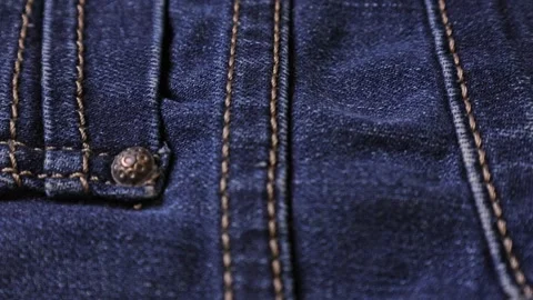 Explore the intricate details of denim stitching and hardware close-up, showcasi Stock Footage 302569348