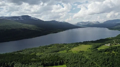 Explore Lake Gjevilvatnet in Oppdal Norway With Stunning Mountain Aerial Views Stock Footage 329305546
