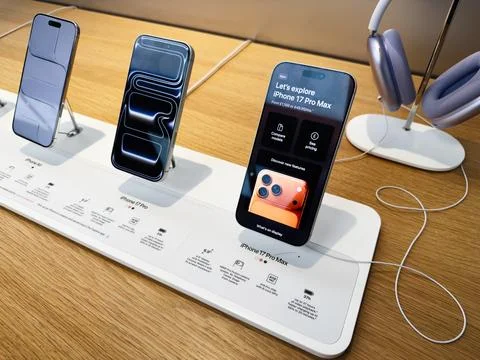 Explore the latest iPhone models in a modern Apple store display with sleek.. Stock Photos