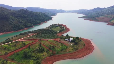 Explore Lộc Tân Lake in Bảo Lâm, Lâm Đồng, Vietnam, with clear water and 스톡 동영상 333669576