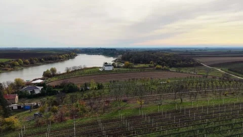 Explore the lush fields and rivers in this agricultural drone view Video stock 321545437