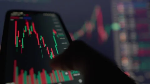 Explore Mobile Stock Trading Analyzing Candlestick Charts and Market Trends for Stock Footage 284714661