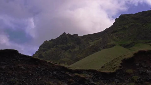 Explore the mountain rocks and sky at Reynisfjara Beach in Iceland 스톡 동영상 329442685