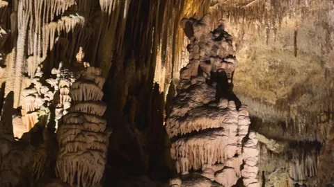 Explore nature view inside dark cave. Tourist attraction: caves stalactites and Stock Footage 346297021