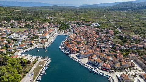 Explore the old town of Stari Grad and its harbor set against the backdrop of Stock Photos
