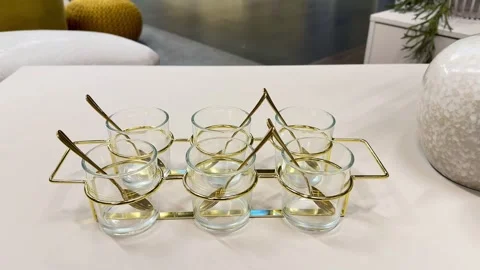 Explore our Elegant Glass Dessert Cups with a beautiful Gold Frame, ideal for Stock Footage 304831179