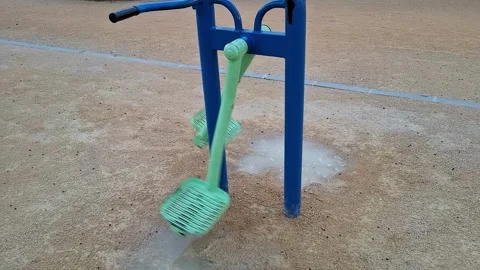 Explore a playground exercise machine designed for outdoor fitness at a cit.. Stock Footage 337351873