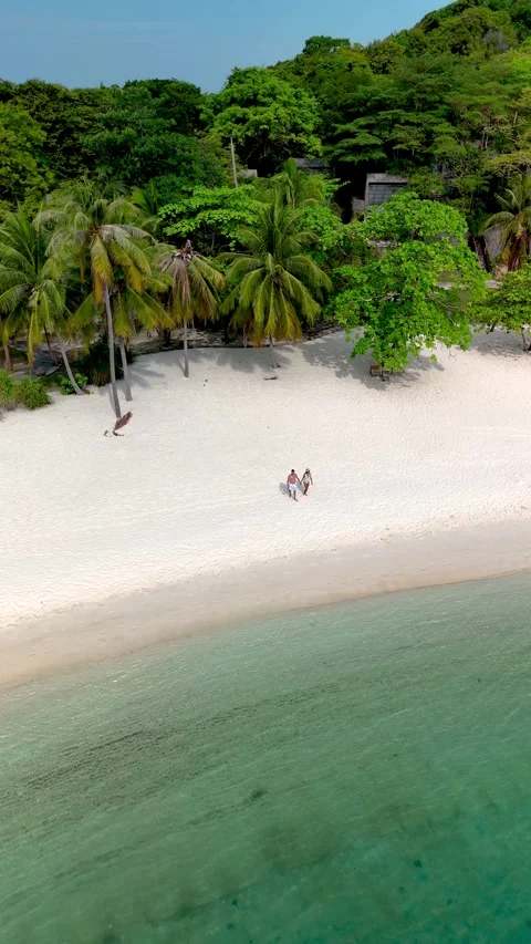 Explore the pristine shoreline of Koh Kham, Thailands hidden tropical paradise Stock Footage 318385946