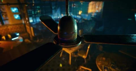 Explore the quiet atmosphere of a dimly lit cafe with a fan spinning above Ilustração Stock