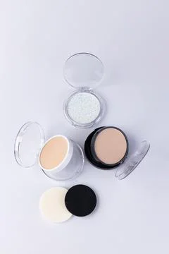 Explore the Range of Makeup Products Featuring Powder Compacts and Application Stock Photos