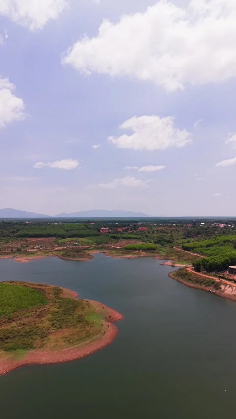 Explore Ray Lake in Vietnam from above. The bright sun lights up the water Stock Footage 336502195