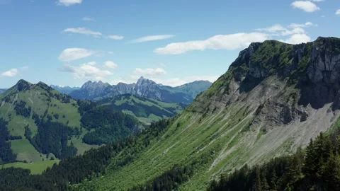 Explore scenic mountain views on a sunny day in Switzerland Stock Footage 320262874
