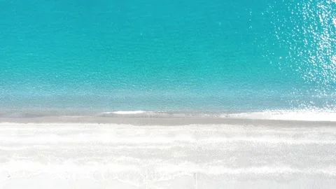 Explore the Serene Beauty of a Quiet Beach With Crystal Clear Water and Soft Stock Footage 317761969