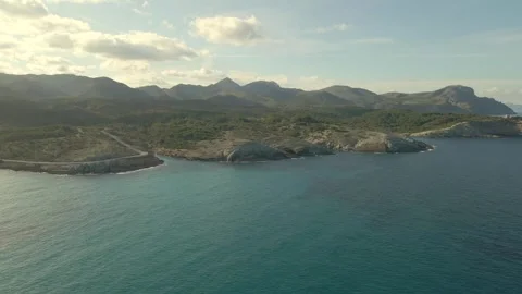Explore the serene coastline of Cala Torta near Cala Mesquida in Mallorca Stock Footage 302993374