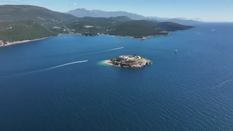 Explore the stunning aerial view of Otocic Gospa surrounded by vibrant blue Video stock 287786498