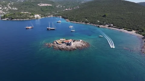 Explore the stunning aerial view of Otocic Gospa, a beautiful island in Kotor Stock Footage 287786593